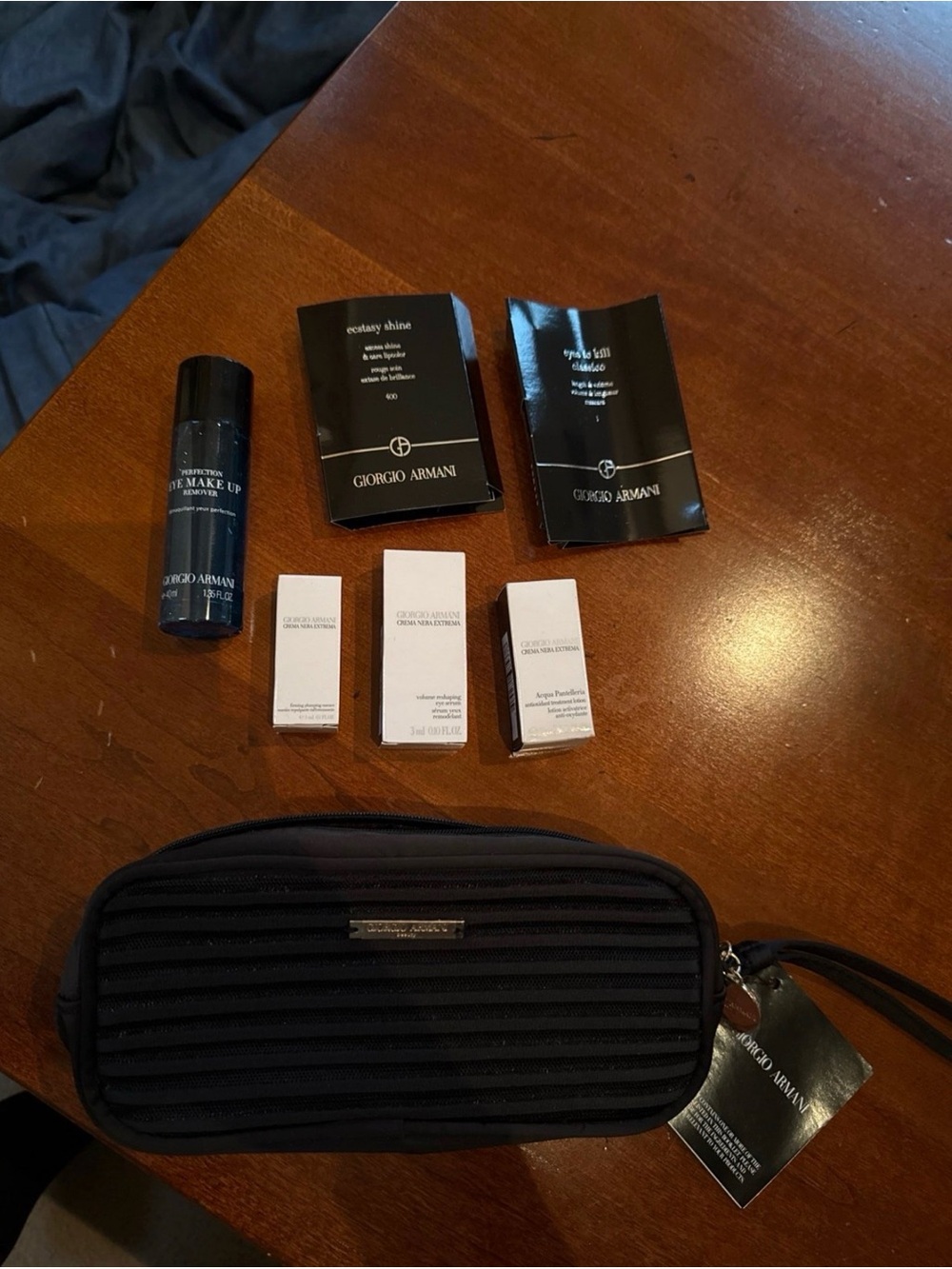 Giorgio Armani luxury products with travel bag